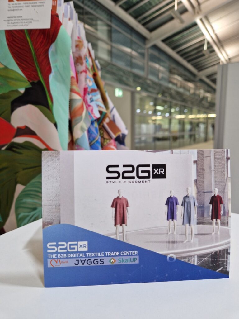 S2G XR booth at Munich Fabric Start 2025, with virtual garment mannequins and presentation of the immersive B2B textile platform