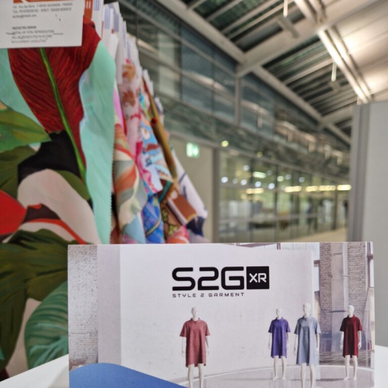 S2G XR booth at Munich Fabric Start 2025, with virtual garment mannequins and presentation of the immersive B2B textile platform